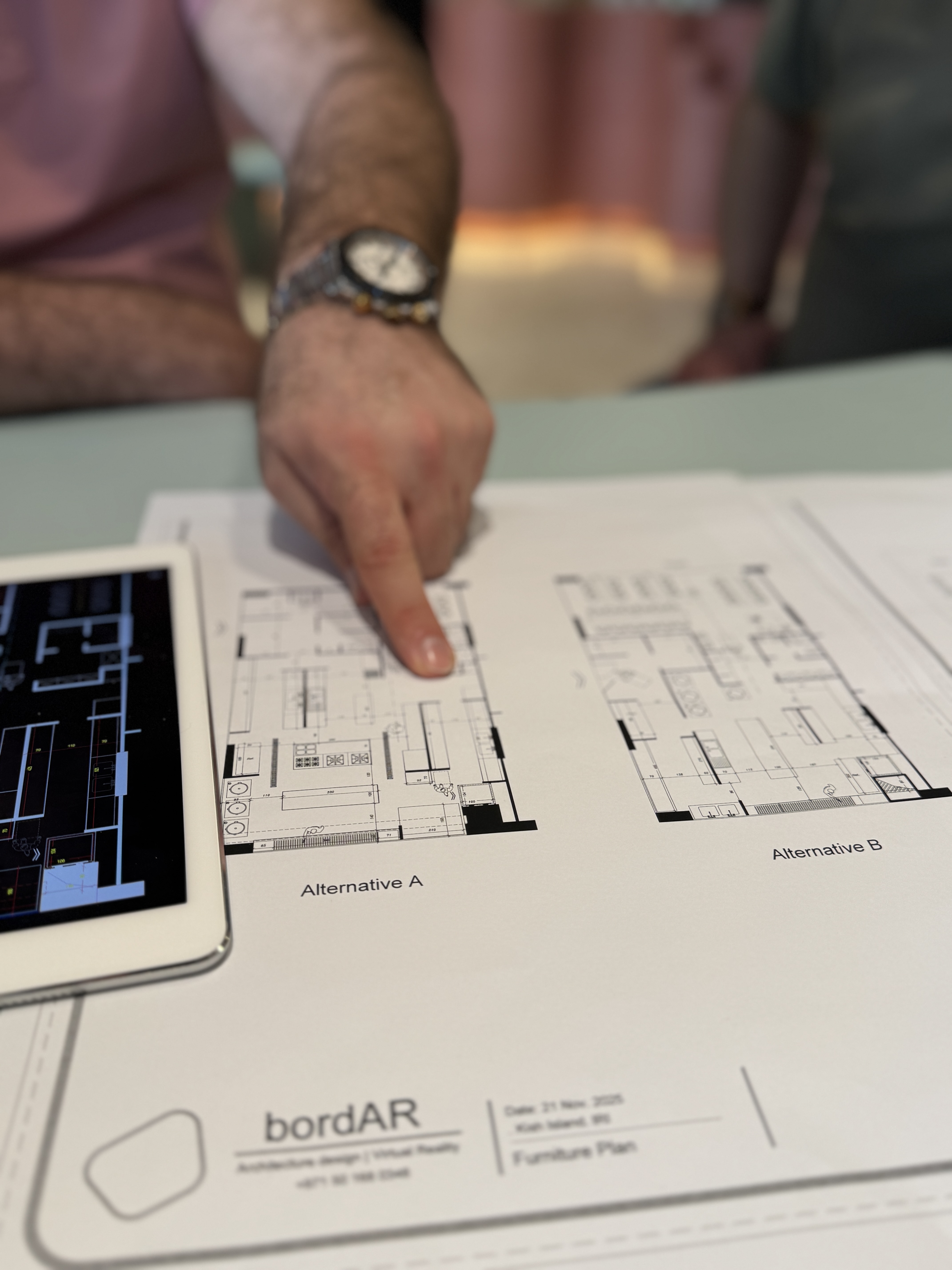 bordAR architectural review meeting over printed plans
